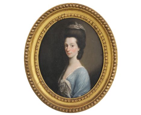 Circle of John Downman (Welsh, 1750-1824),An oval bust length portrait of a lady wearing a blue dress adorned with pearls,Oil