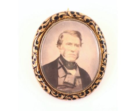 A Victorian miniature portrait mourning brooch, the oval hand embellished portrait of a gentleman laid on ivory, set within a