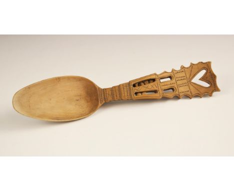 A 19th century ‘sycamore’ Welsh love spoon, the terminal with openwork heart detail above carved decoration and two openwork 