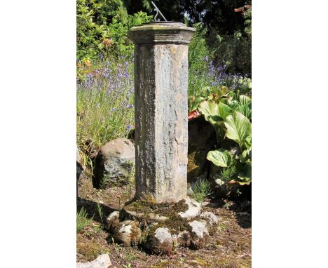 * A sandstone plinth of hexagonal form, with sundial, raised on a capital, 105cm H Condition report:   10cm historic chip to 