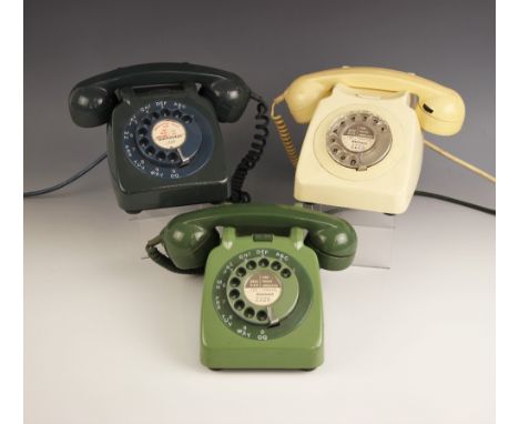 Three vintage Bakelite wedge shaped telephones, mid 20th century, ivory coloured, light green and dark green (3) 