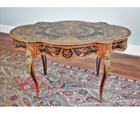 * A Louis XVI style kingwood and marquetry centre table, late 19th century, in the manner of Pierre Langlois, the shaped serp