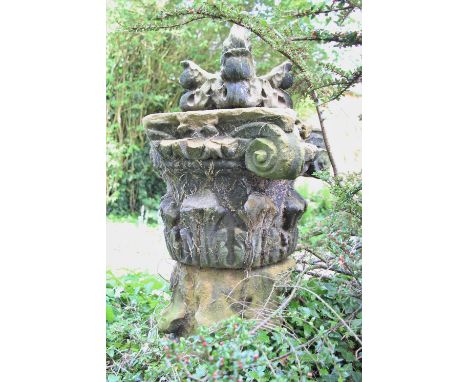 * A pair of Acanthus sandstone capitals, on plinth base, 105cm H, topped with corbel (3) 