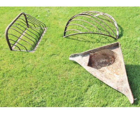 * Two cast iron hayracks and a feed trough (3) 
