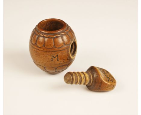 A walnut nutcracker, possibly late 17th century, the spherical nutcracker with engraved rope and scalloped border above screw
