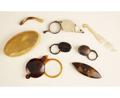 A horn framed eyeglass, early 20th century, the circular eyeglass naively engraved 'MM Worthington' to one side, and 'MMW She