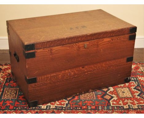 * A scumbled pine country house trunk, late 19th/early 20th century, the hinged top applied with the initials ‘A.F.M’, metal 