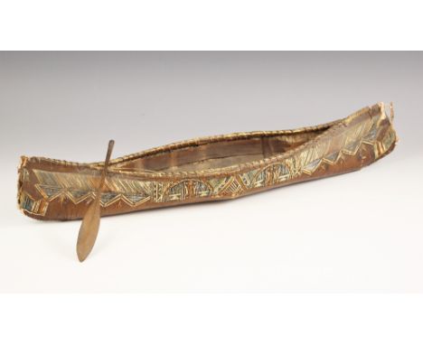 A North American mic mac model canoe with paddle, late 19th century, of birch bark and porcupine quill construction, with col