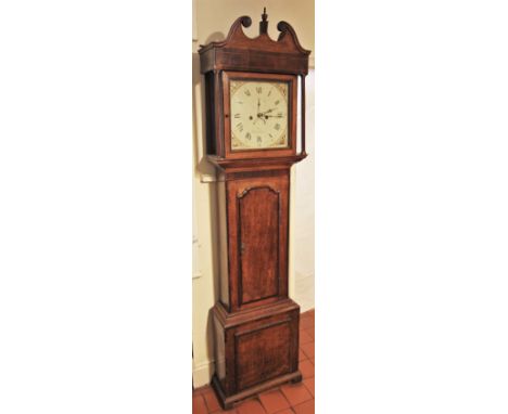 * A George III oak and mahogany crossbanded eight day longcase clock by Joyce of Whitchurch, the twin swan neck pediment over