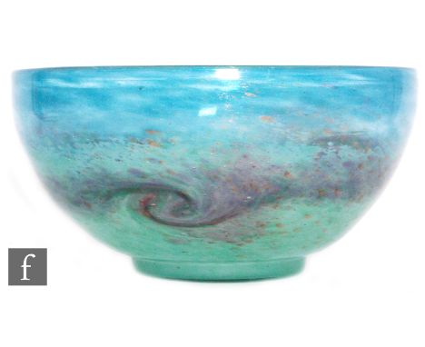 Monart - A large 1930s bowl of footed circular form, shape AF, with a band of tonal purple paisley swirl over a mottled jade 