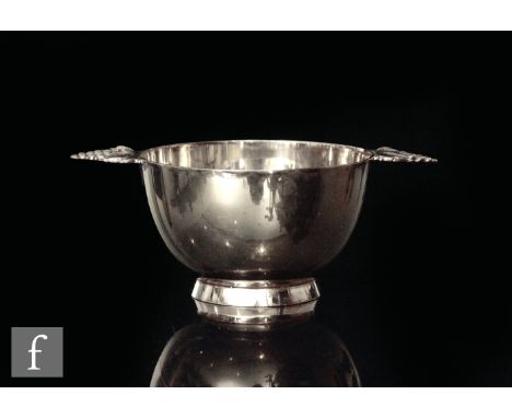 Tiffany &amp; Co - A Sterling silver sugar bowl of footed form with leaf and berry handles, gold plated, height 5cm, weight 4