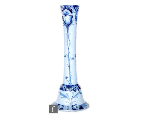 William Moorcroft - James Macintyre &amp; Co - An early 20th Century Florian Ware candlestick with bell shaped base and taper