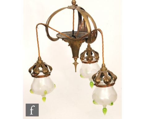 Unknown - A copper and brass three pendant light fitting, brass open work body terminating in three part frosted shades with 