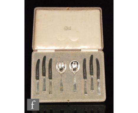 Georg Jensen - A set of six Danish silver and steel fruit knives with a conforming spoon and fork, import marks London 1930, 