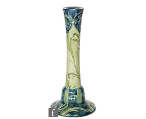 William Moorcroft - Liberty &amp; Co - A single candlestick decorated with tubelined stylised poppies and foliage, all in ton