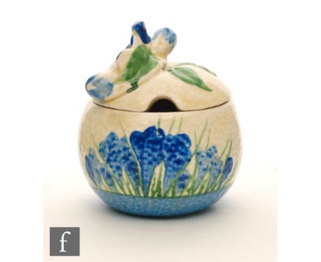 Clarice Cliff - Blue Crocus - An orange shaped preserve pot and cover with flowering bough finial, hand painted with tonal bl