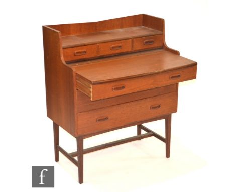 Unknown - A teak ply writing desk, with shelf over pull-out writing surface and fitted drawers, height 94cm, width 76cm and d