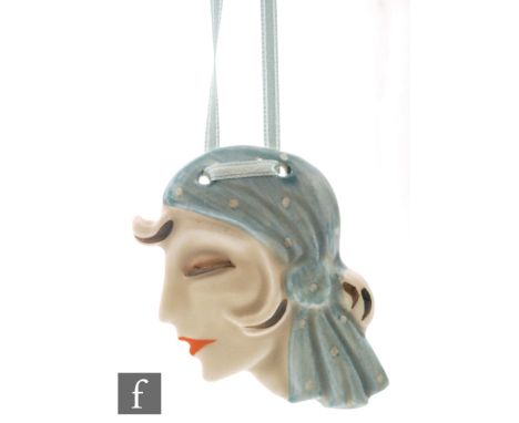 Clarice Cliff - Florrie - A ceramic pendant modelled as a fashionable lady in profile wearing a polka dot head scarf picked o