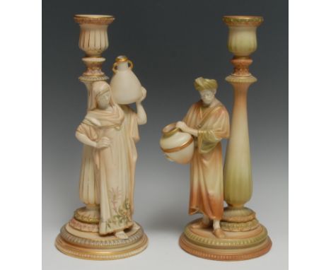 A matched pair of Royal Worcester figural candlesticks, The Cairo Water Carriers, in green, burnished gilt and blush ivory, 3