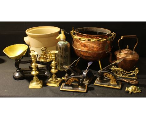 A set of Libra Scale Co balance scales and weights;  a pair of brass ejector candlesticks;  a copper kettle;  a soda sipher; 