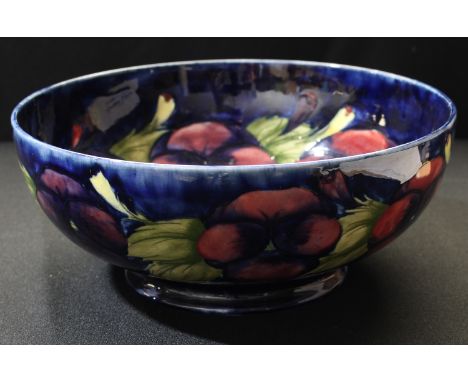 A Moorcroft pansy fruit bowl, 25cm diameter 
