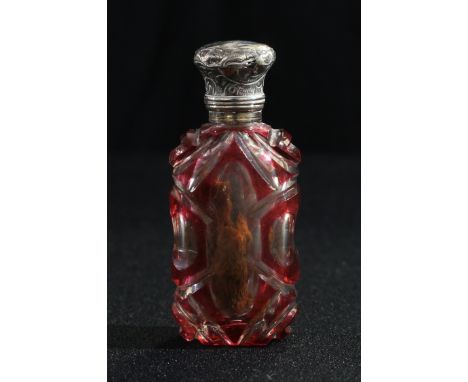 A Victorian overlaid ruby glass scent bottle, silver mounted 