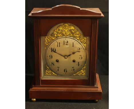 A late 19th century mahogany bracket clock, silver dial inscribed with Arabic numerals and applied with gilt spandrels, eight