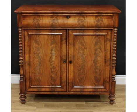 A 19th century mahogany low chiffonier or side cabinet, hipped rectangular top above a serpentine front drawer and a pair of 