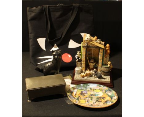 A Poole pottery black model of a Cat, 16.5cm high; a Linda Jane Smith Comic &amp; Curious Cat Outside Privy resin sculpture, 