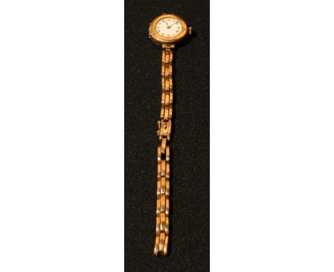 A 9ct rose gold lady's watch, white enamel dial, Roman numerals, integral 9ct rose gold expanding bracelet strap, 19.5g 