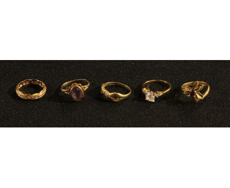 A 9ct gold amethyst ring, a 9ct gold and diamond eternity ring, a 9ct gold sapphire and diamond chip ring, a 9ct gold amethys