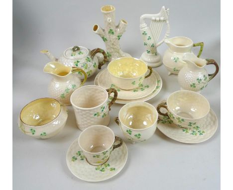 A collection of Belleek Shamrock items, including a small teapot, second black mark to the base (1891-1926), a cup & saucer t