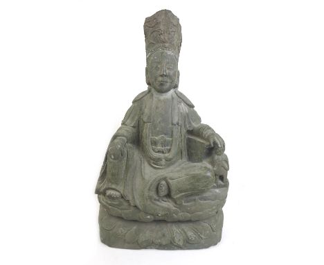 A Chinese stone carved statue of Kwan Yin, with recess to back of statue, 36 by 19 by 60cm high. 