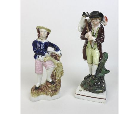 An early 19th century Staffordshire pottery figure, modelled as a shepherd carrying a sheep over his shoulder, representing t
