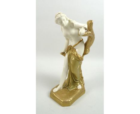 An Edwardian Royal Worcester porcelain figurine, modelled as The Bather Surprised, after Sir Thomas Brock, model number 486, 