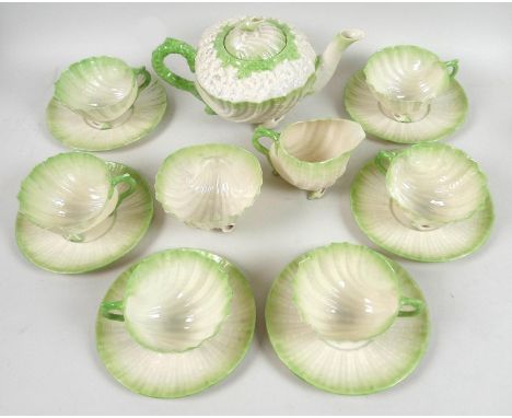 A 19th century Belleek Neptune tea service with green tint, comprising a teapot, 21.5 by 13 by 12.5cm high, six cups and sauc