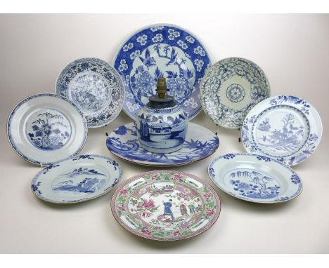 A group of 19th century Japanese porcelain and stoneware, including two blue and white chargers, one with two birds amidst fl