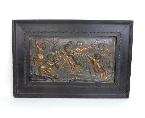 After Francois Boucher (1703-1770) a 19th century bronzed panel 'Putti playing with a goat', unsigned, 18.6 by 35cm, mounted 