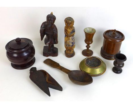 A group of nine carved wood collectables, an eastern partially painted carved figure 18cm high, an arrow head form inkwell wi