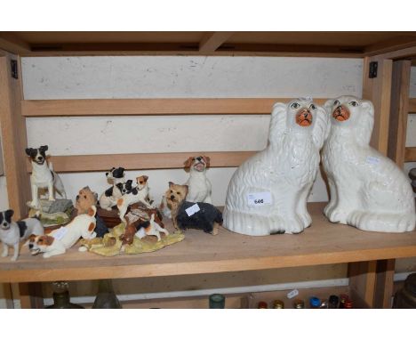 A pair of Staffordshire style spaniels and a quantity of resin model terriers