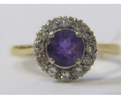 AMETHYST CLUSTER RING, An 18ct yellow gold on platinum mounted ring set central amethyst surrounded by diamonds, size 'M' 