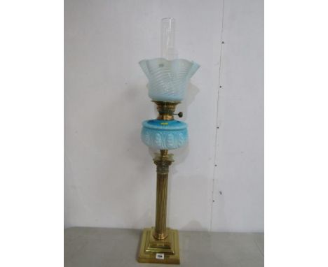 VICTORIAN OIL LAMP, brass square base column support oil lamp with blue milk glass reservoir and vaseline glass crinoline sha
