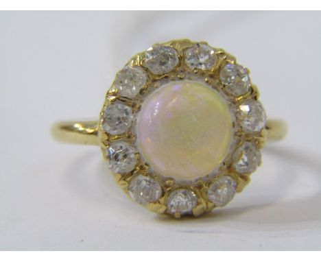 18ct YELLOW GOLD OPAL &amp; DIAMOND CLUSTER RING, principal cabochon cut round opal surrounded by old cut diamonds in heavy 1