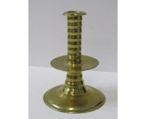 EARLY METALWARE, 17th century brass circular based 14cm candlestick with ribbed stem 