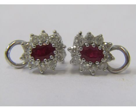 PAIR OF 18ct WHITE GOLD RUBY &amp; DIAMOND CLIP ON EARRINGS, principal oval cut rubies surrounded by well matched brilliant c