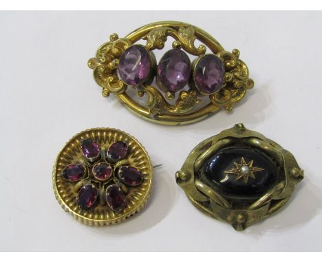 3 VINTAGE YELLOW METAL BROOCHES, 2 set with amethyst type stone, 1 with deep red stone, star set seed pearl, multi stone amet