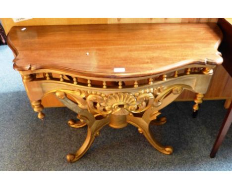 A mahogany topped bow fronted console table, with gilt wood base, 110cm wide