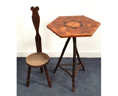 RUSTIC HEXAGONAL MARQUETRY INLAID TABLE with playing card motif to the top, standing on tripod legs in the form of tree branc