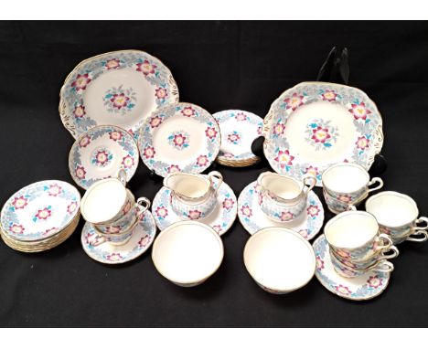 NEW CHELSEA PART TEA SETcomprising ten cups, eleven saucers, nine plates, two cake plates, two sugar bowls and two jugs