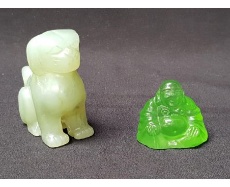 CHINESE GREEN JADE STYLE CARVED FOO DOGwith carved features, 5.5cm high; and a small green buddha 3.5cm high (2)